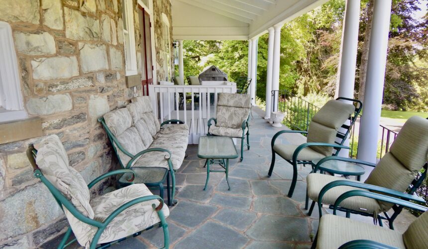 Main House porch with chairs and sofa
