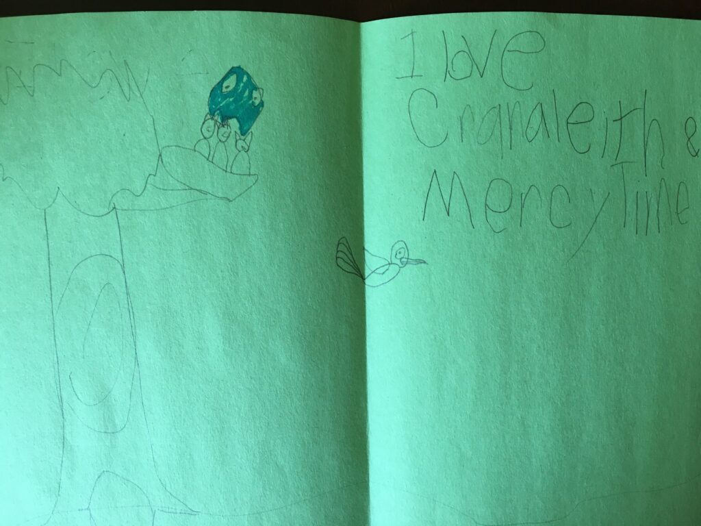 A child 's drawing of an animal and the words " i love creature mercy ".