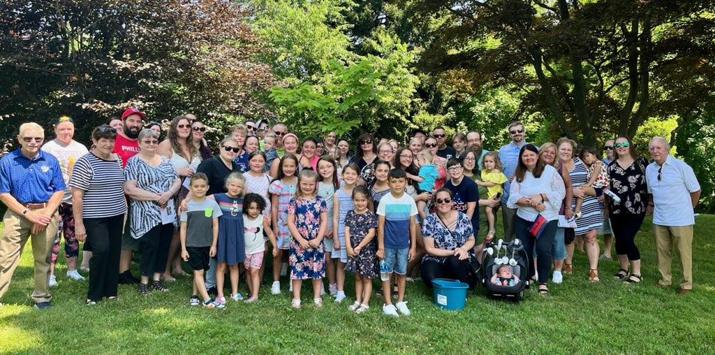 A large group of children with parents.