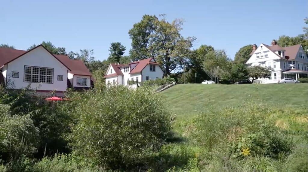 A Photo showing all of cranaleith's buildings, taken from the pond area.