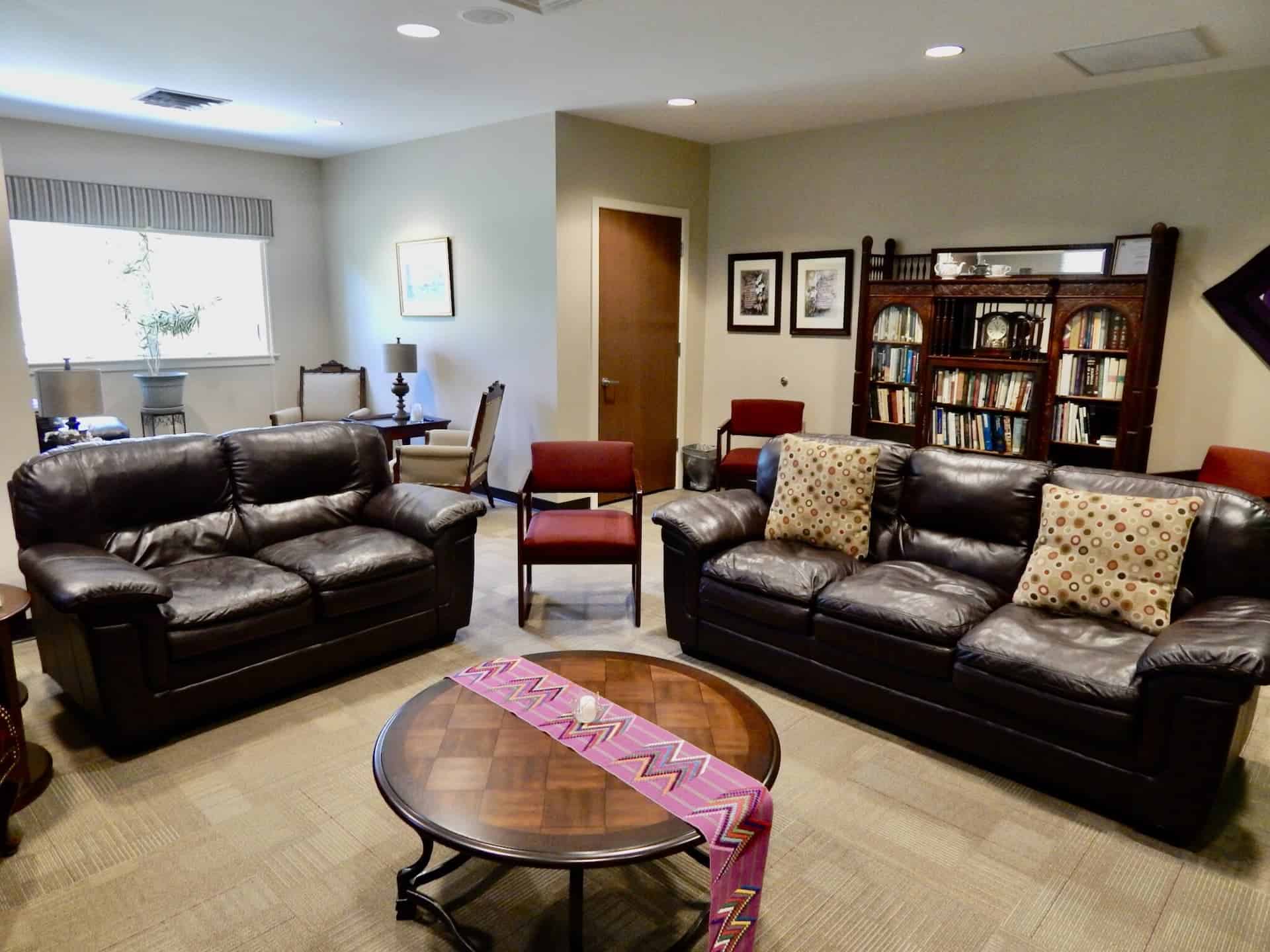 Catherine McAuley room, with brown leather seats, wooden furniture aand chairs. A small intimate setting.