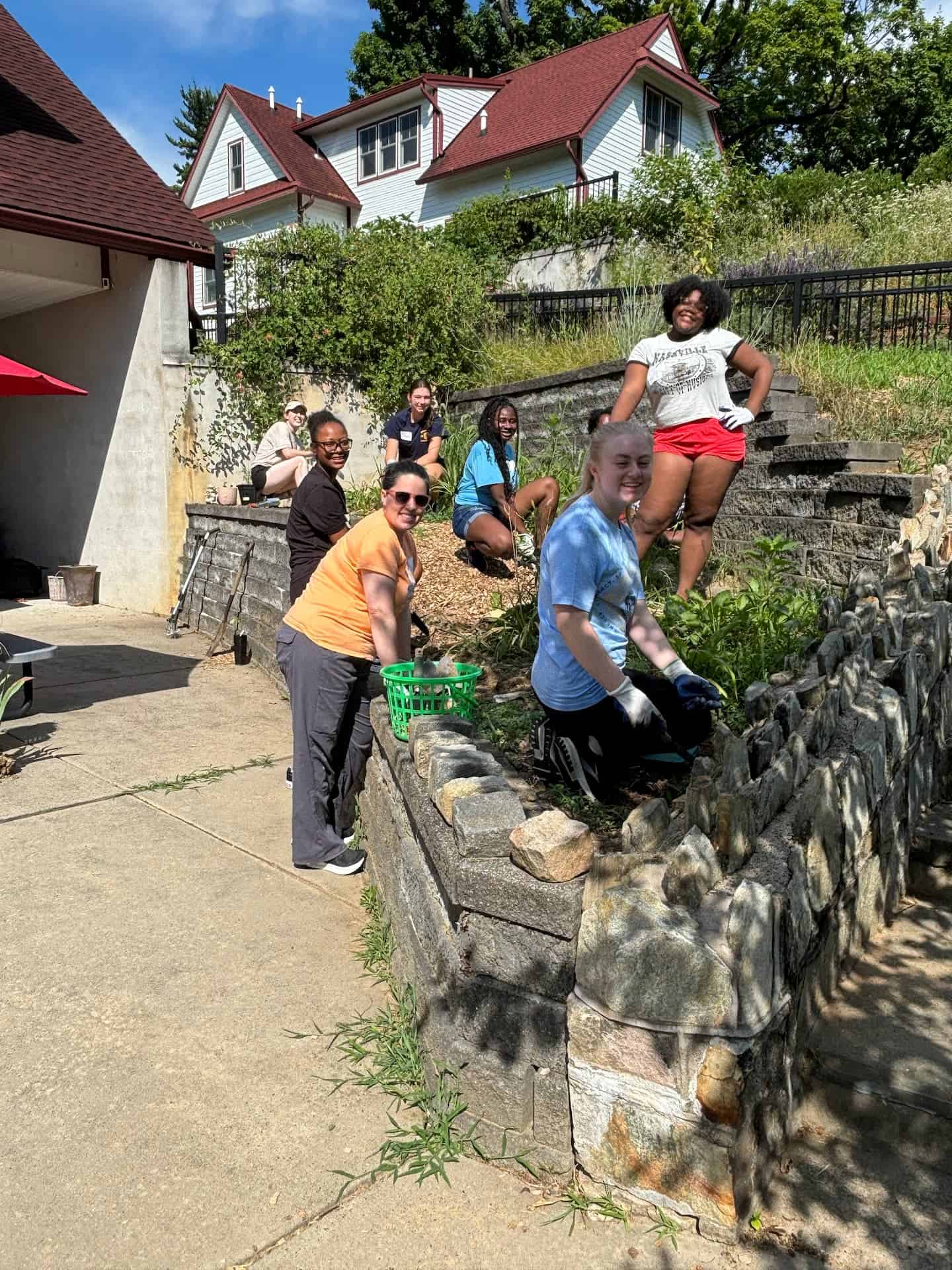 Merion Mercy volunteer ladies working on the grounds.