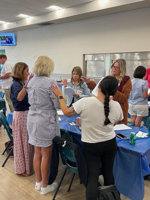 A Group discussing during an activity at a faculty retreat in Manhattan Beach.